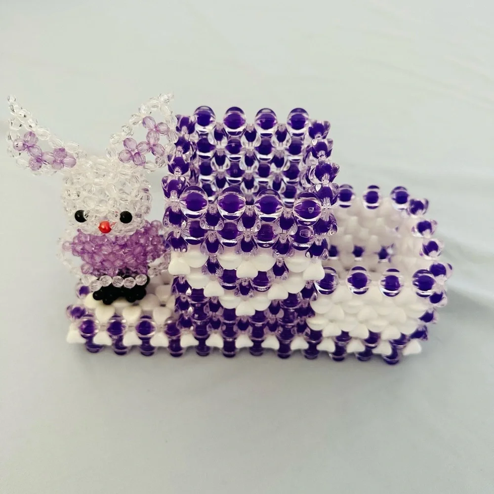 A cute little bunny pencil holder handmade beads in shades